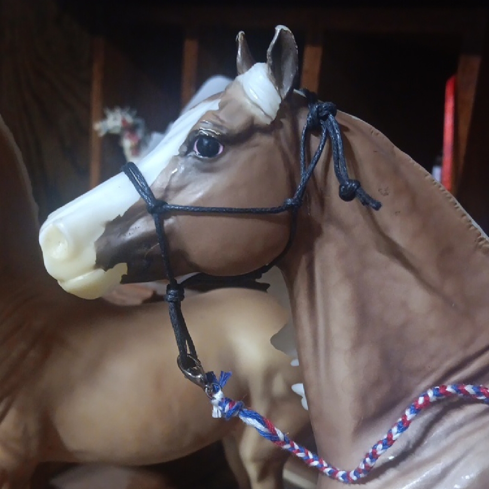 Brown and White Horse Figurine with Black Bridle